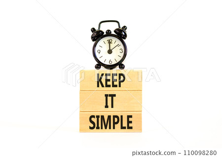 Keep it simple symbol. Concept word Keep it simple on beautiful wooden block. Black alarm clock. Beautiful white table white background. Business motivational keep it simple concept. Copy space. Keep it simple symbol. Concept word Keep it simple on beautiful wooden block. Black alarm clock. Beautiful white table white background. Business motivational keep it simple concept. Copy space. 110098280