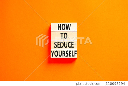 How to seduce yourself symbol. Concept word How to seduce yourself on wooden blocks. Beautiful orange table orange background. Business and how to seduce yourself concept. Copy space. 110098294