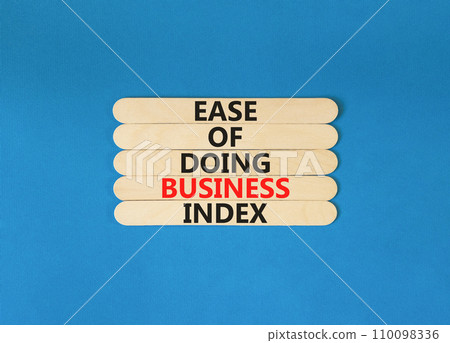 Ease of doing business index symbol. Concept words Ease of doing business index on wooden stick. Beautiful blue table blue background. Business, ease of doing business index concept. Copy space. Ease of doing business index symbol. Concept words Ease of doing business index on wooden stick. Beautiful blue table blue background. Business, ease of doing business index concept. Copy space. 110098336