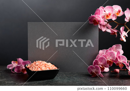 Beautiful blooming orchid flowers and pink sea salt. 110099660