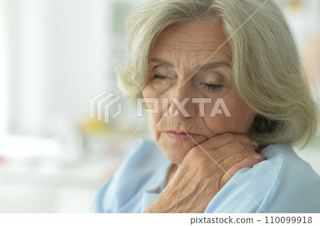 Close up portrait of sick old woman 110099918