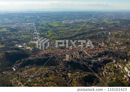 Aerial view of dense historic center of Thiers town in Puy-de-Dome department, Auvergne-Rhone-Alpes region in France. Rooftops of old buildings and narrow streets Aerial view of dense historic center of Thiers town in Puy-de-Dome department, Auvergne-Rhone-Alpes region in France. Rooftops of old buildings and narrow streets 110101423