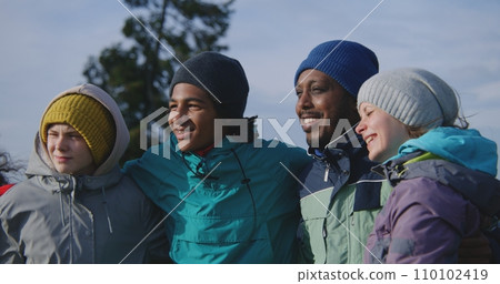 Tourist group of diverse travelers take picture on trip in mountains Tourist group of diverse travelers take picture on trip in mountains 110102419