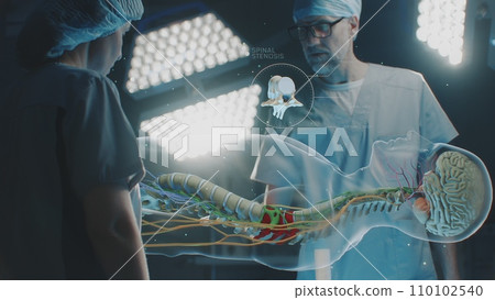 Male and female surgeons using holographic display in medicine 110102540