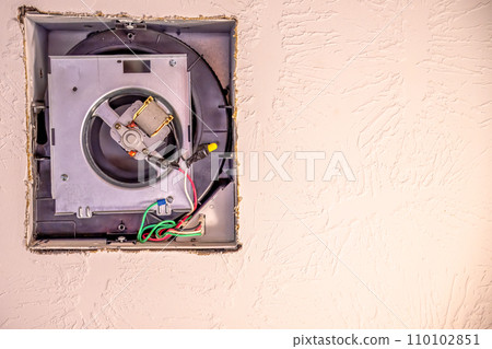 Open cover of a ceiling fan in a bathroom in order to replace a broken unit Open cover of a ceiling fan in a bathroom in order to replace a broken unit 110102851