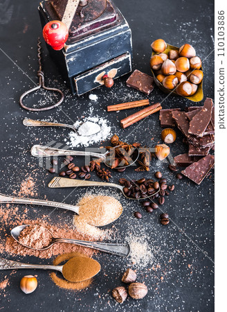 Sweet spices and chocolate on a table Sweet spices and chocolate on a table 110103886