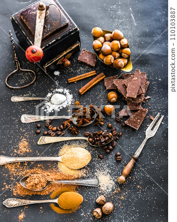 Sweet spices and chocolate on a table Sweet spices and chocolate on a table 110103887