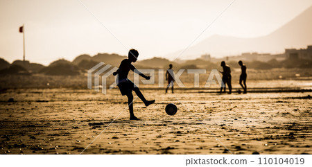 Silhouette of boy on the beach Silhouette of boy on the beach 110104019