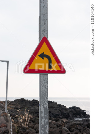 A road sign pointing to the left A road sign pointing to the left 110104140