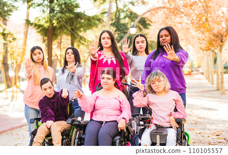 International womens day. Women diverse group doing hand gesture to stop domestic abuse violence International womens day. Women diverse group doing hand gesture to stop domestic abuse violence 110105557
