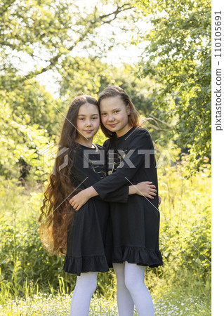 Siblings Day Two Children, Sisters Smile and Hug . Green Trees, Park on Background. Love. Joyful Carefree Girls Lifestyle Childhood. Horizontal. Brothers and Sisters Day. Vertical Siblings Day Two Children, Sisters Smile and Hug . Green Trees, Park on Background. Love. Joyful Carefree Girls Lifestyle Childhood. Horizontal. Brothers and Sisters Day. Vertical 110105691