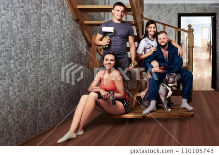 Young people with construction tools in their hands are preparing for home repairs. 110105743