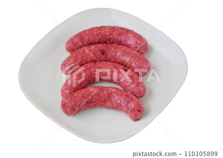 Sausages isolated on white background. Homemade minced meat. Cooking at home. Preparation meat sausage. 110105899