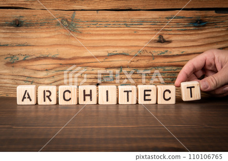 ARCHITECT. Alphabet blocks on wood texture background ARCHITECT. Alphabet blocks on wood texture background 110106765