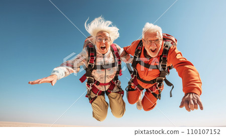 Smiling senior couple in skydiving adventure, radiating joy, excitement and exhilaration. Embracing adrenaline-filled activity at any age. Living life to fullest in retirement. Breaking age barriers Smiling senior couple in skydiving adventure, radiating joy, excitement and exhilaration. Embracing adrenaline-filled activity at any age. Living life to fullest in retirement. Breaking age barriers 110107152