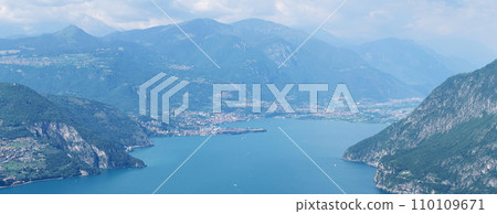 Mountain landscape, picturesque mountain lake in the summer morning, large panorama. Iseo, Italy Mountain landscape, picturesque mountain lake in the summer morning, large panorama. Iseo, Italy 110109671