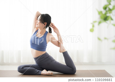 Full body of a young woman doing yoga Full body of a young woman doing yoga 110109881