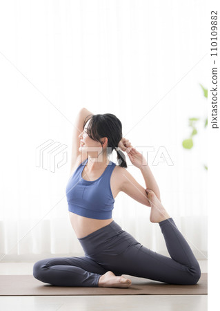Full body of a young woman doing yoga Full body of a young woman doing yoga 110109882