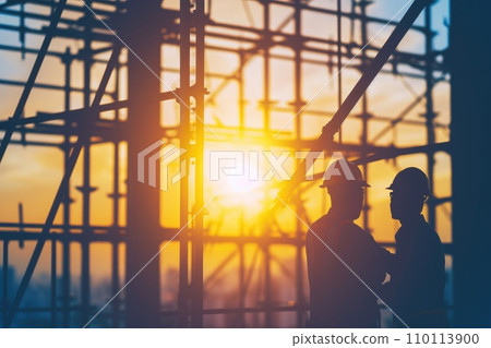 AI-generated content. Silhouette of construction workers on the construction site at sunset 110113900