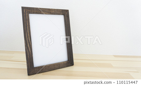 photo frame placed on a wooden shelf photo frame placed on a wooden shelf 110115447