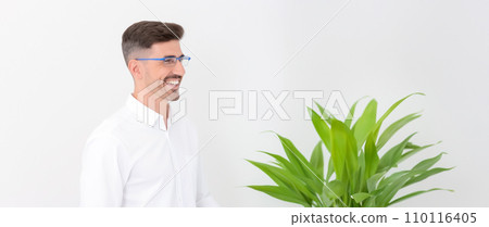 Portrait of a young programmer on a white background, preparing for a presentation or advertising of a financial product, copy space for concept Portrait of a young programmer on a white background, preparing for a presentation or advertising of a financial product, copy space for concept 110116405