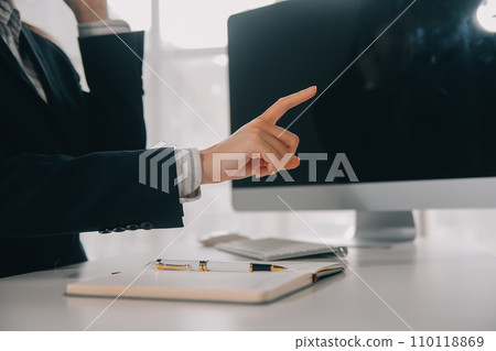 Communication support, call center and customer service help desk. VOIP headset on telephone keyboard. 110118869