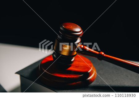 image of judge's hammer, scales lady of justice, law book, laptop computer and contract documents with pen concept of law and justice. 110118930