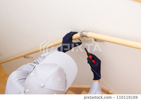 Installation of handrails on stairs, construction site 110119189