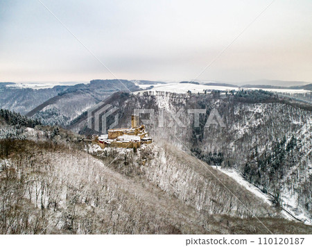 aerial view rock with medieval castle Ehrenburg near moselle river Brodenbach white winter snow wonderland forest hills 110120187
