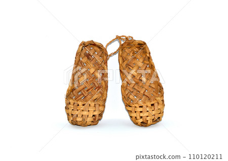 Russian traditional ancient bast shoes made of bast isolated on white background 110120211