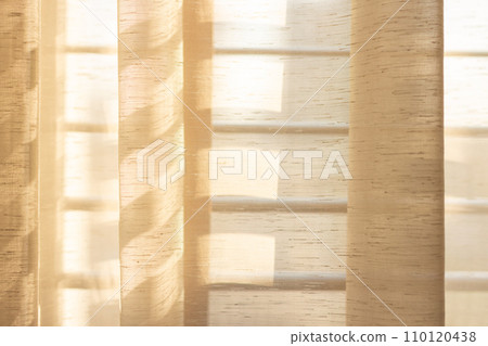 Close up texture of curtain and light of sun Close up texture of curtain and light of sun 110120438