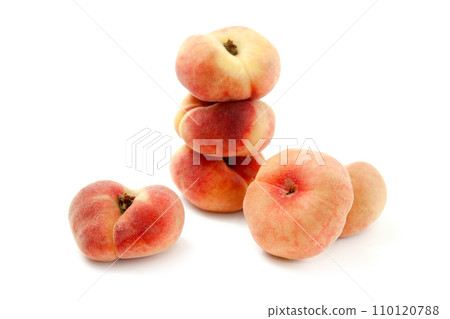 Several saturn peaches or flat peaches isolated on white background with clipping path.. Several saturn peaches or flat peaches isolated on white background with clipping path.. 110120788