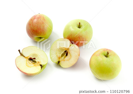 Half and whole of green apples isolated on white background with clipping path.. Half and whole of green apples isolated on white background with clipping path.. 110120796