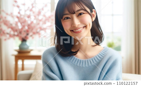 Smiling woman wearing a blue sweater Smiling woman wearing a blue sweater 110122157