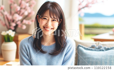 A young woman relaxing in the living room 110122158