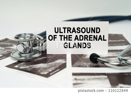 On the ultrasound pictures there is a business card with the inscription - Ultrasound of the adrenal glands On the ultrasound pictures there is a business card with the inscription - Ultrasound of the adrenal glands 110122849