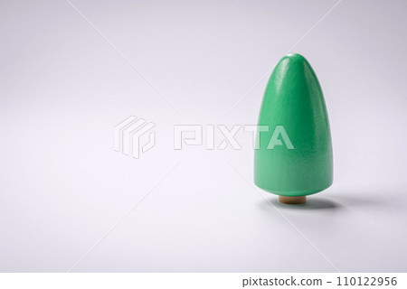 Wooden model of a tree with a green crown and trunk on a white background Wooden model of a tree with a green crown and trunk on a white background 110122956