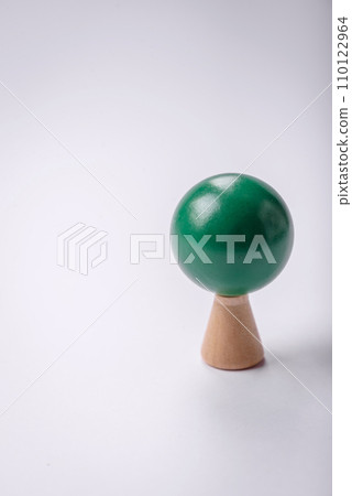 Wooden model of a tree with a green crown and trunk on a white background 110122964
