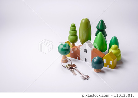 A small wooden house and keys as an idea for investing in your own home 110123013