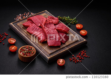Juicy fresh raw beef meat with salt, spices and herbs 110123160