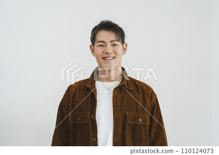 Man in his 30s looking at camera, white background portrait 110124073