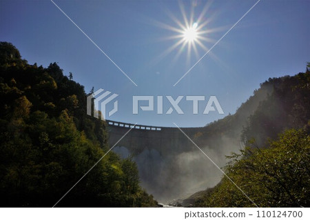Kurobe Dam water discharge and the sun seen from downstream Kurobe Dam water discharge and the sun seen from downstream 110124700