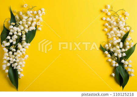 Lily of the valey bunch on yellow background top view 110125218
