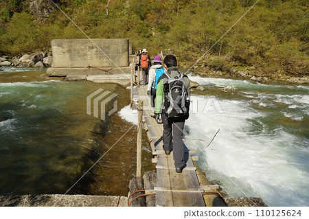 Climber walking through Kurobe Gorge Climber walking through Kurobe Gorge 110125624