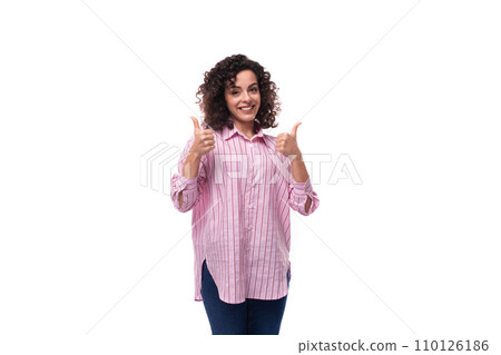 young successful european curly brunette woman in pink shirt on background with copy space young successful european curly brunette woman in pink shirt on background with copy space 110126186