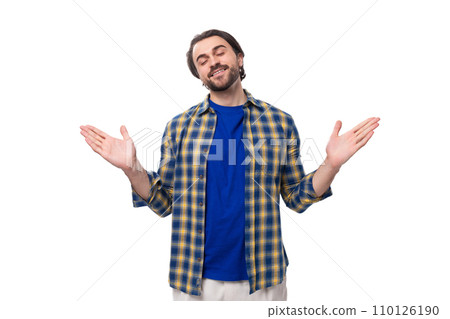 handsome young European brunette man with a well-groomed beard and mustache dressed casually in a 110126190