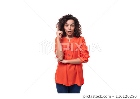 young smart caucasian business woman with curly hairstyle dressed in orange shirt feels inspired 110126256