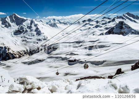 Snowy mountains. Beautiful landscape with snowy rocks. View from the top of Mount Elbrus 110126656