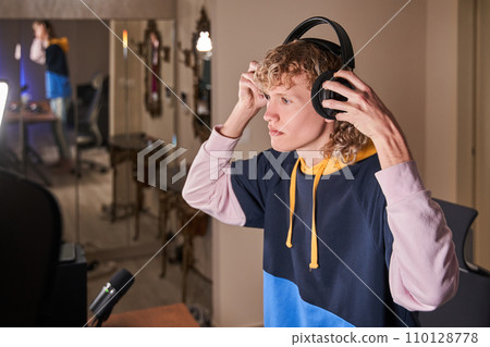 Young active guy in his room Young active guy in his room 110128778