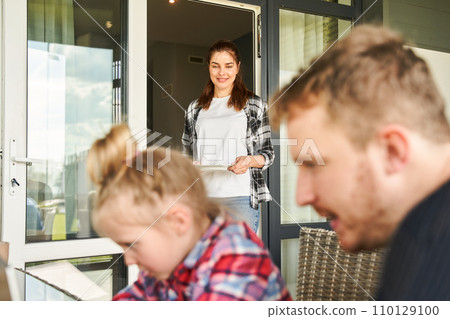 Focused father spending time with daughter at laptop computer 110129100